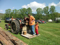 Making rope at back of old tractor